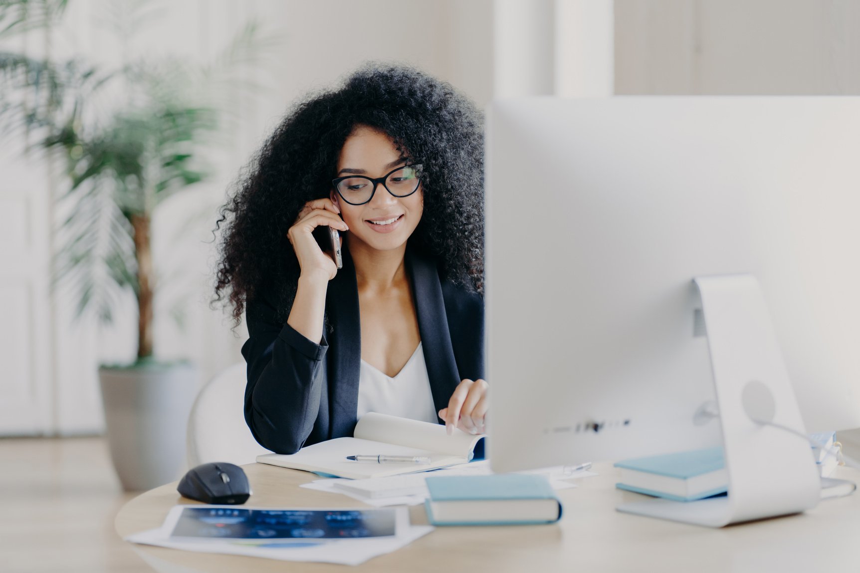 Woman in the Office Talking on the Phone